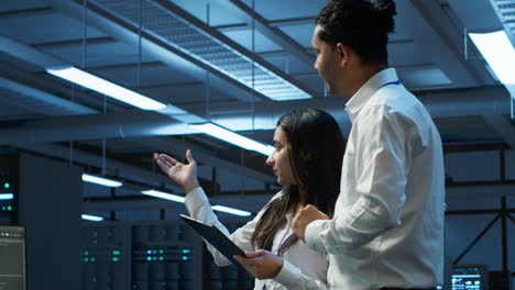 employee using green screen devices in server farm used for automation