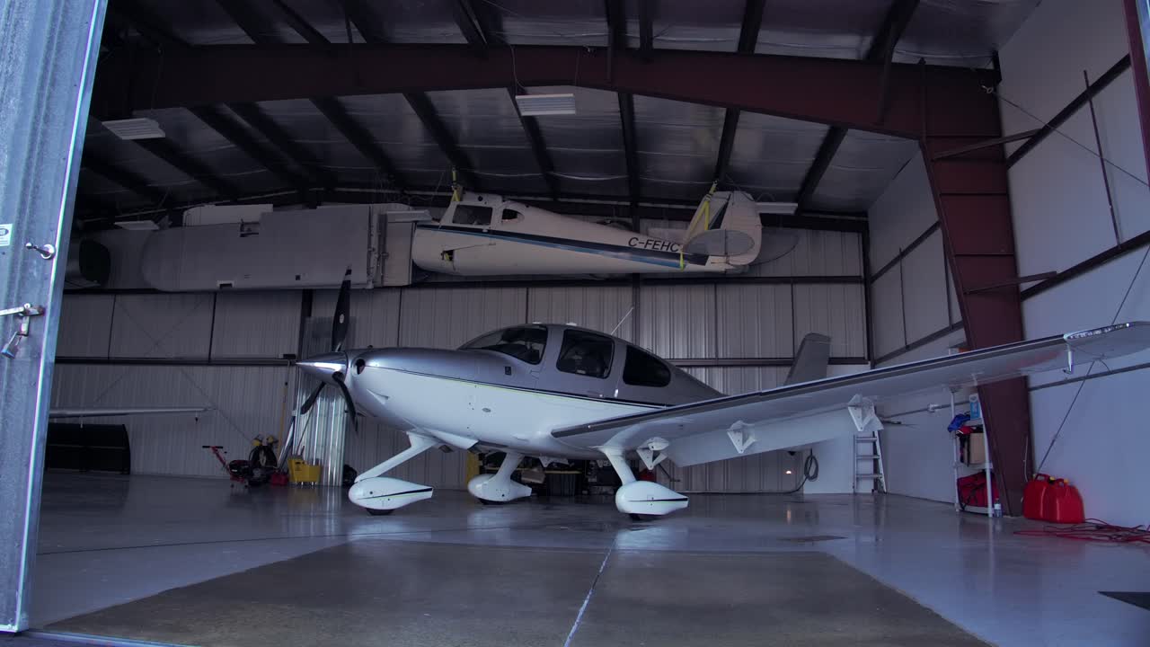 Airplane Hangar Doors Closing into Frame - Cirrus SR22 Inside - Static