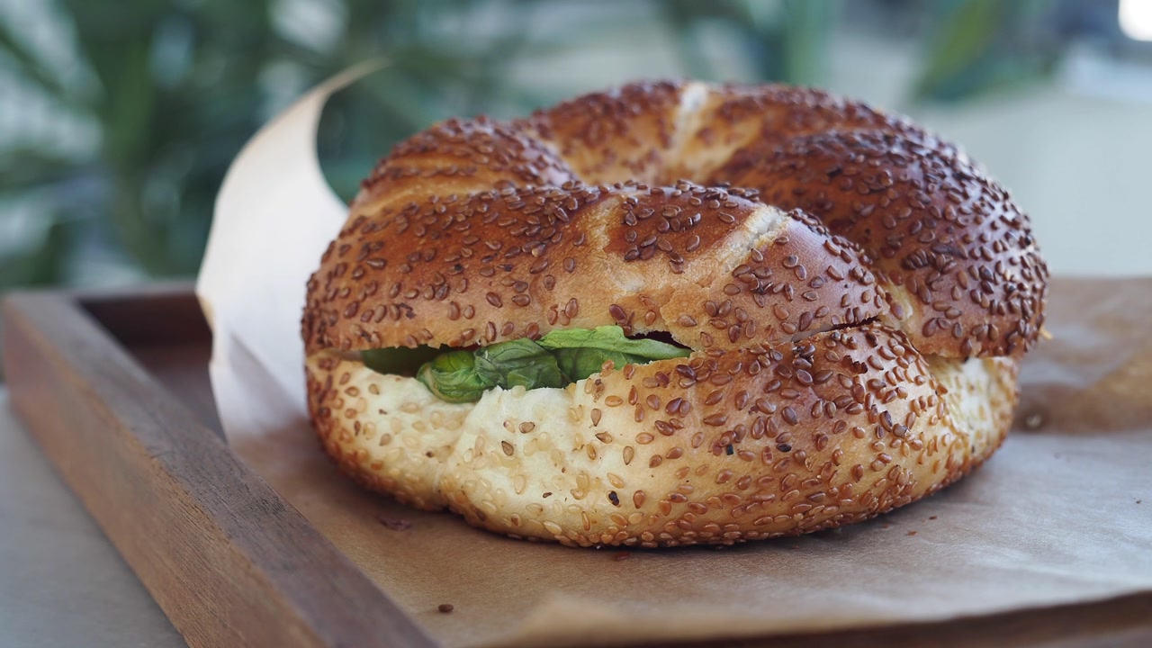 Close-up of a Fresh Simit Sandwich with Cream Cheese and Spinach