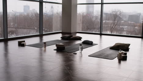 empty yoga studio with city view