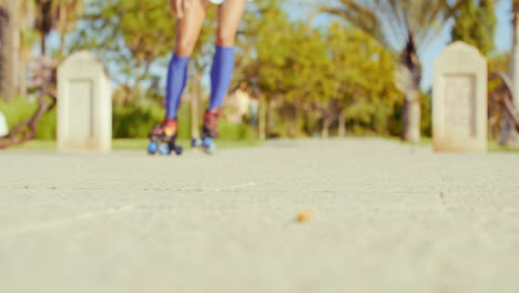 Low-Angle-Video-of-a-Girl-Riding-Roller-Skates