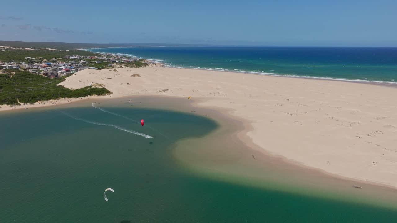 Aerial view of sandy beach with kite surfers in Witsand, South Africa