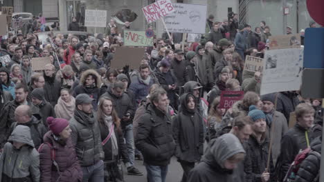 crowd of people marching during artikel 13 protest in march 2019 in berlin, germany.