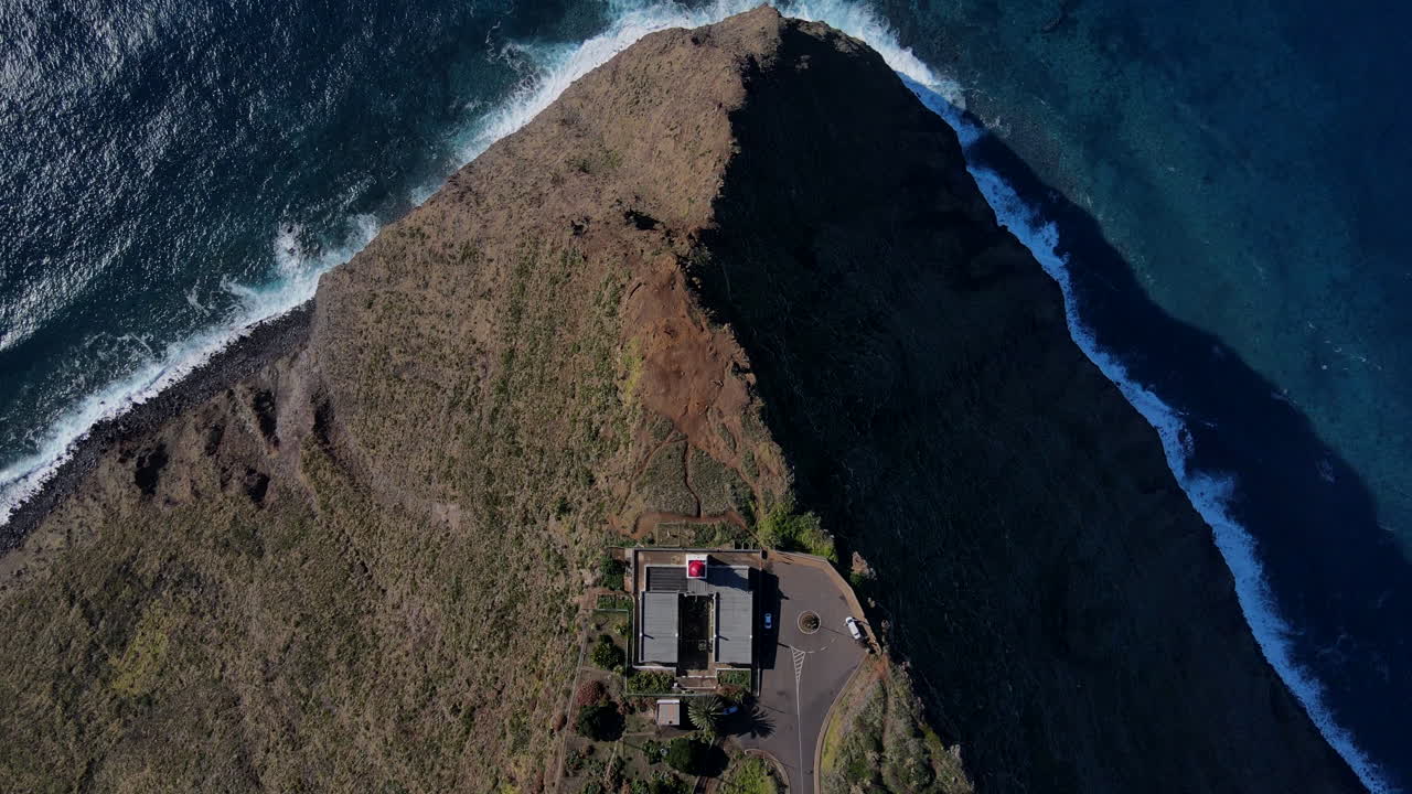 Ponta do Pargo Lighthouse: A natural wonder on Madeira - A shot that shows the lighthouse and the stunning landscapes of the island, such as mountains, cliffs, and the sea