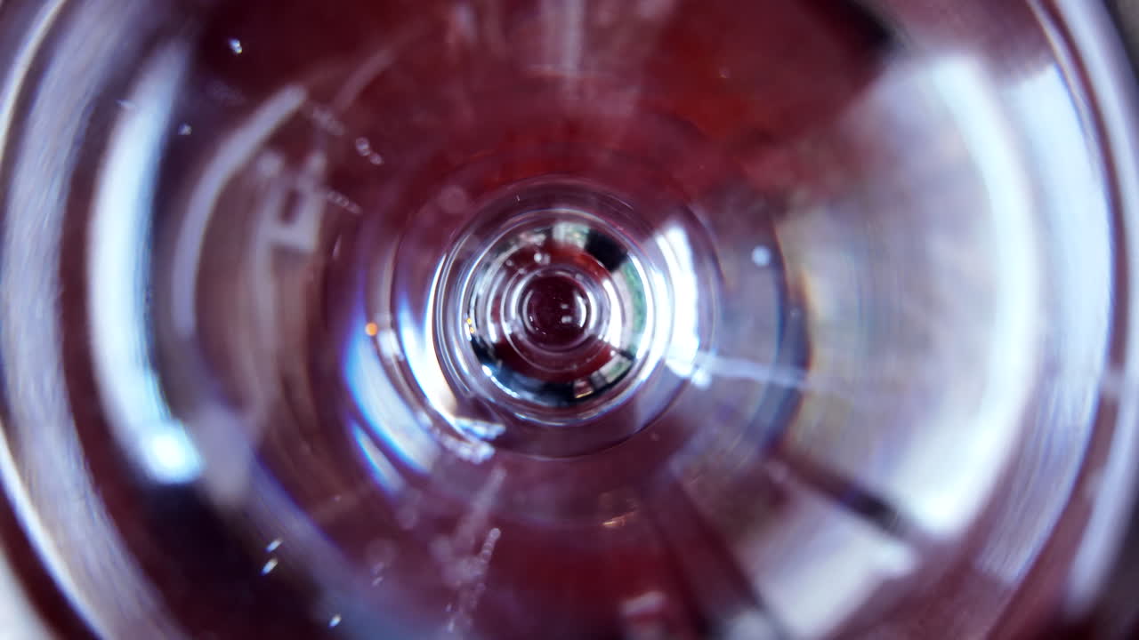 Slow motion pouring of mineral water on a glass close pu