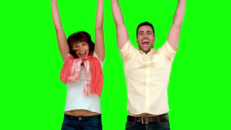 Two-friends-jumping-on-green-screen