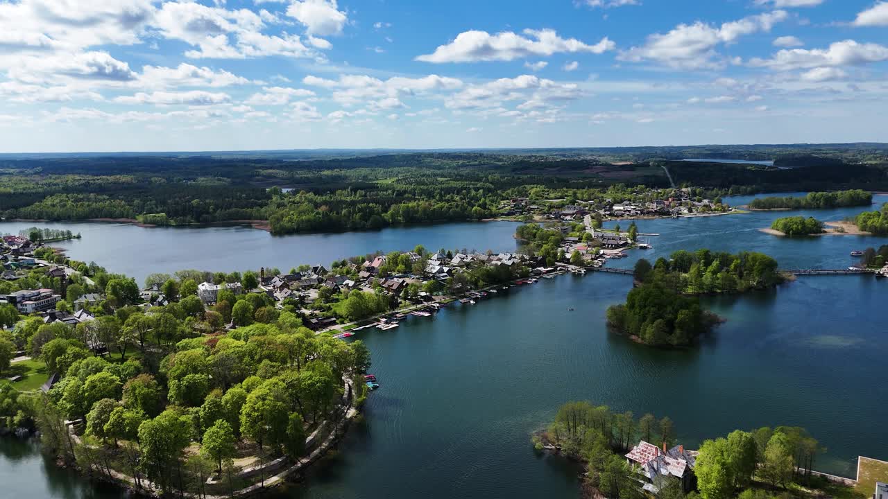 Trakai township, blue lakes and green forest of Lithuania, aerial drone view