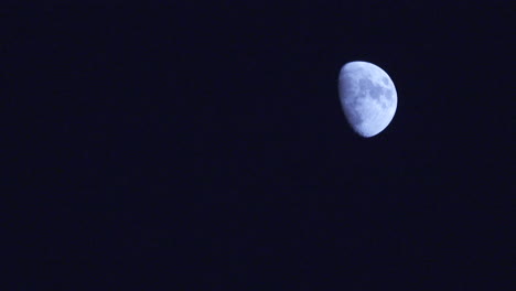 medium close-up of blue moon framed upper-right