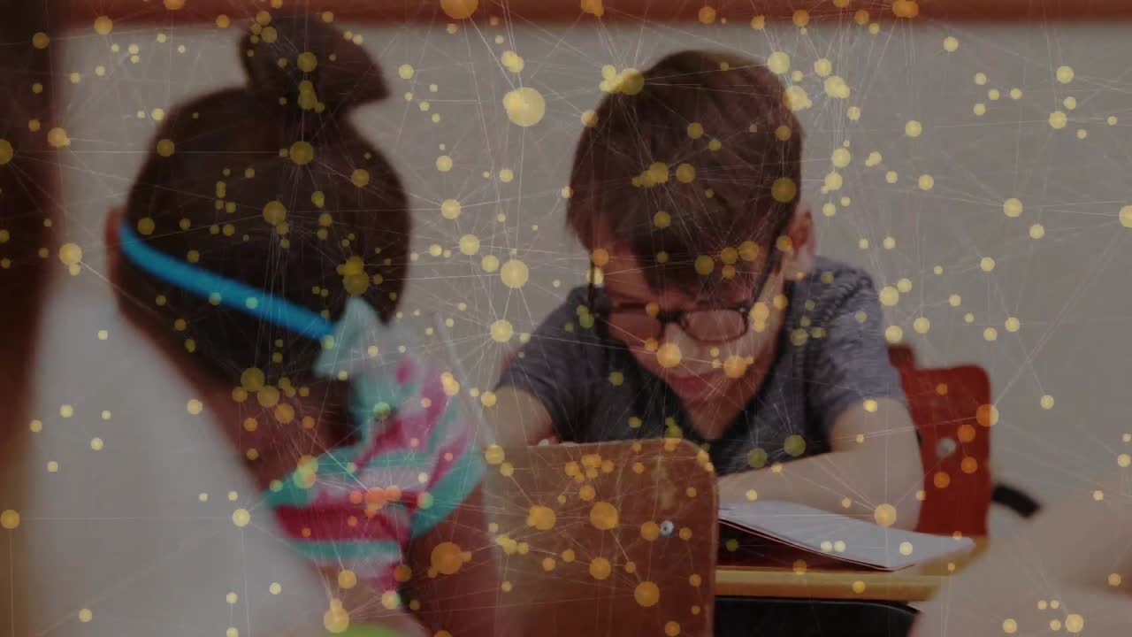 Camera pulling back, revealing peers, boy with glasses writing lesson, gold overlay covering frame