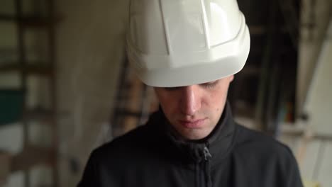 Closeup-Portrait-Of-Home-Inspector-Wearing-White-Hard-Hat-And-Black-Jacket
