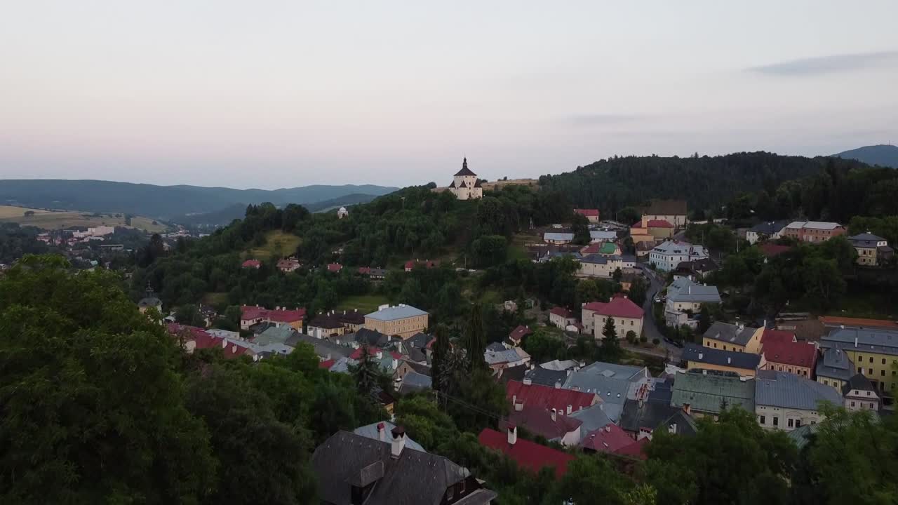 Banska Stiavnica Slovakia small white meddieval church castle on top of hilly village
