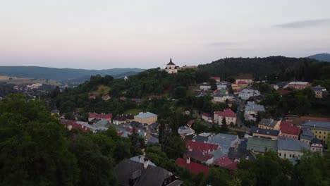 banska stiavnica slovakia small white meddieval church castle on top of hilly village