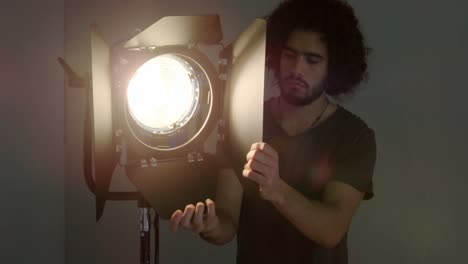 photographer adjusting focus light