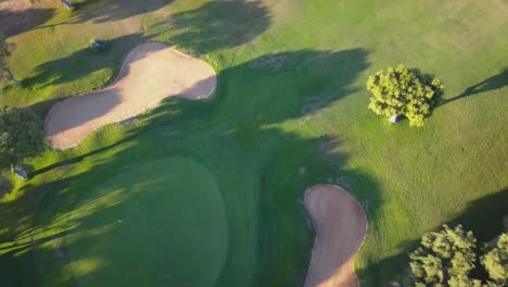 aerial view of a hole area of a golf course with sand bunkers