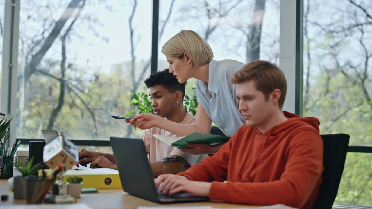Lady boss consulting manager at cabinet close up. Businesswoman training intern