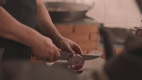 a simple knife cutting of a red onion