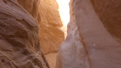 narrow gorge between two high rocky colored orange mountains in egypt canyon site