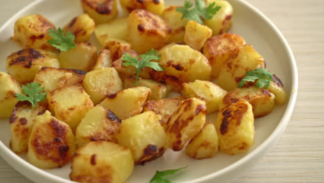 roasted or grilled potatoes  on white plate