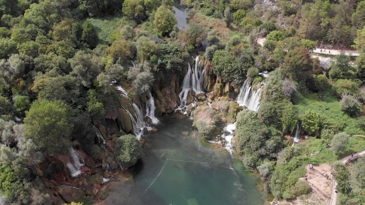 Aerial: Kravica waterfall in Bosnia and Hercegovina. Horizontal pan