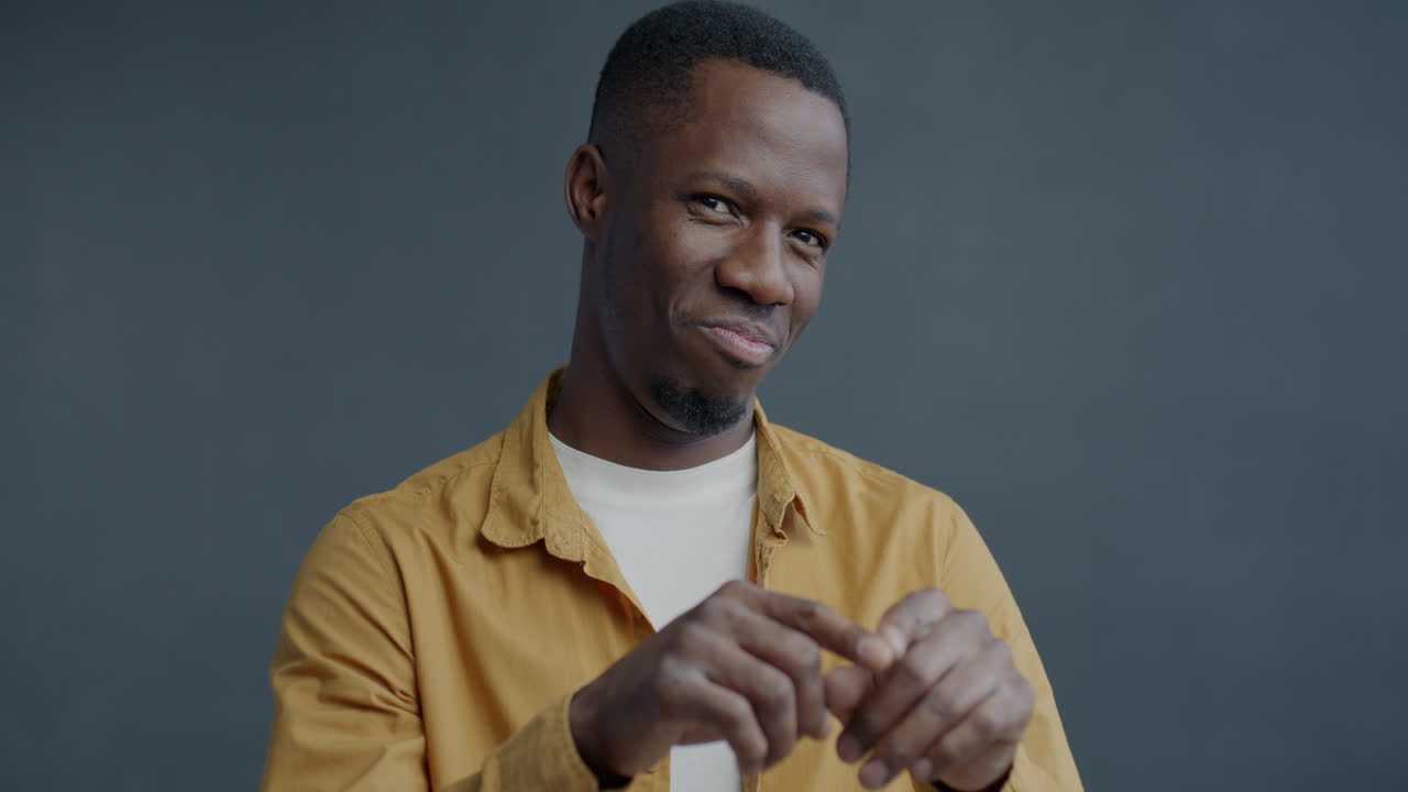 Man Smiling and Gesturing