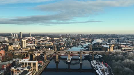 Beautiful-high-wide-of-Newcastle-Upon-Tyne-at-Sunset-as-we-fly-over-Redheugh-Bridge