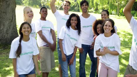 group of volunteers putting their hands together