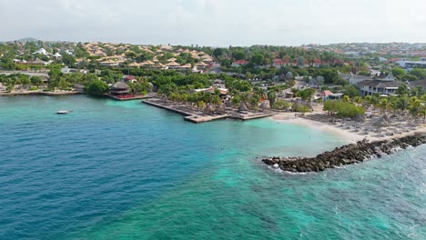 Stunning-clear-turquoise-Caribbean-waters-by-Jan-Thiel-and-Zanzibar-beach,-Curacao,-luxury-tropical-getaway