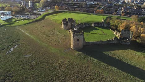 historical flint castle medieval military ruins landmark aerial view slow descend to closeup