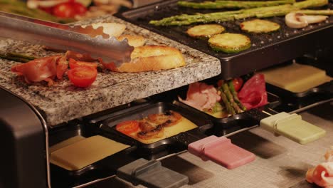 french swiss or spanish restaurant with traditional tapas food, spanish cuisine, delicious tapas and cheese plate, bruschetta with cheese, olives dry tomatoes and tasty sandwich bar appetizer, buffet