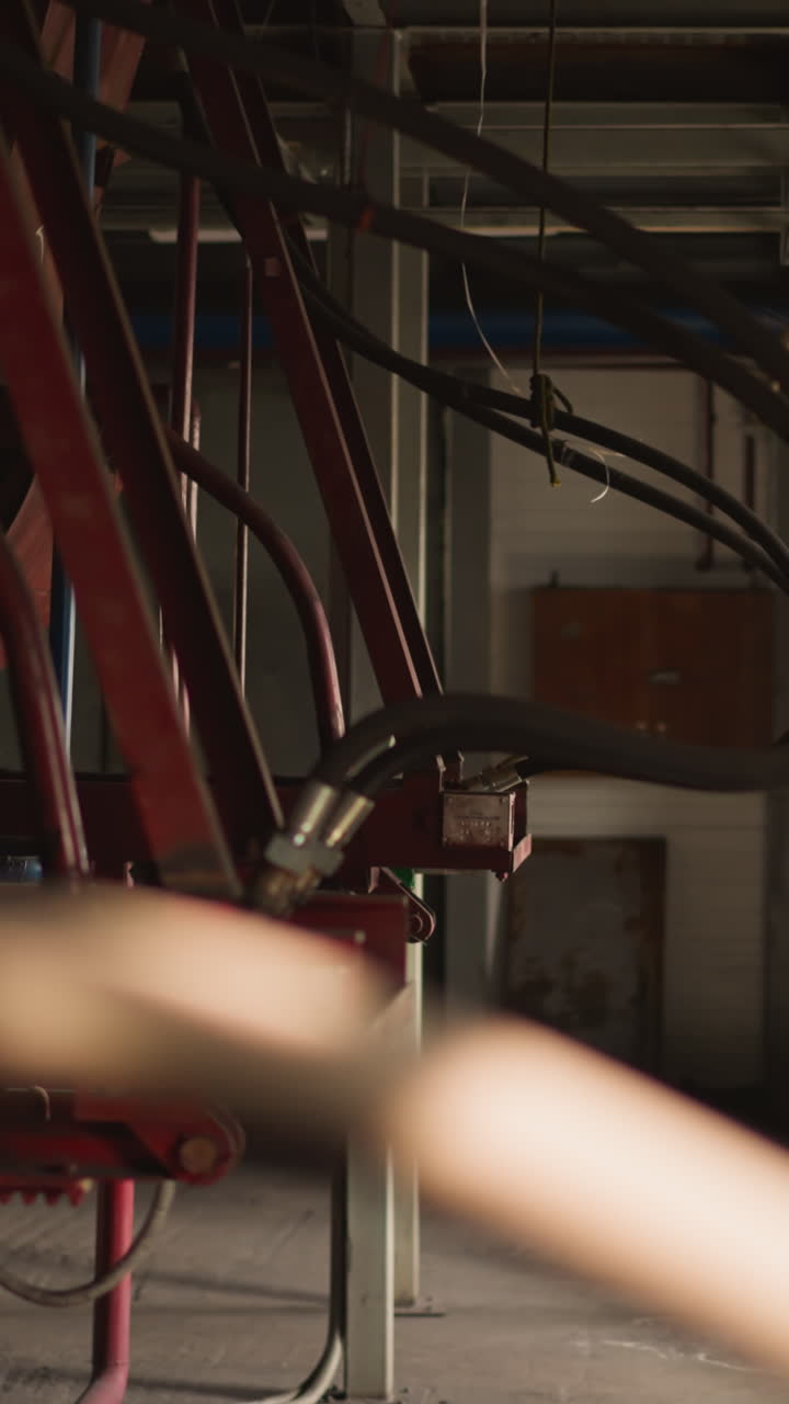 Pipe connected to huge boiler on metal support in mechanical room. Heat generating facilities at industrial station. Building warming technology