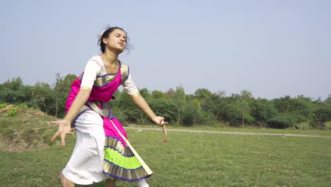 A-bharatnatyam-dancer-displaying-a-classical-bharatnatyam-pose-in-the-nature-of-Vadatalav-lake,-Pavagadh