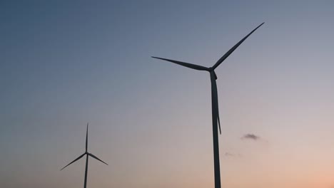 Wind-Turbines-Silhouette-against-the-Blue-sky-during-Sunset,-clean-alternative-energy-in-Thailand-and-mainland-Southeast-Asia