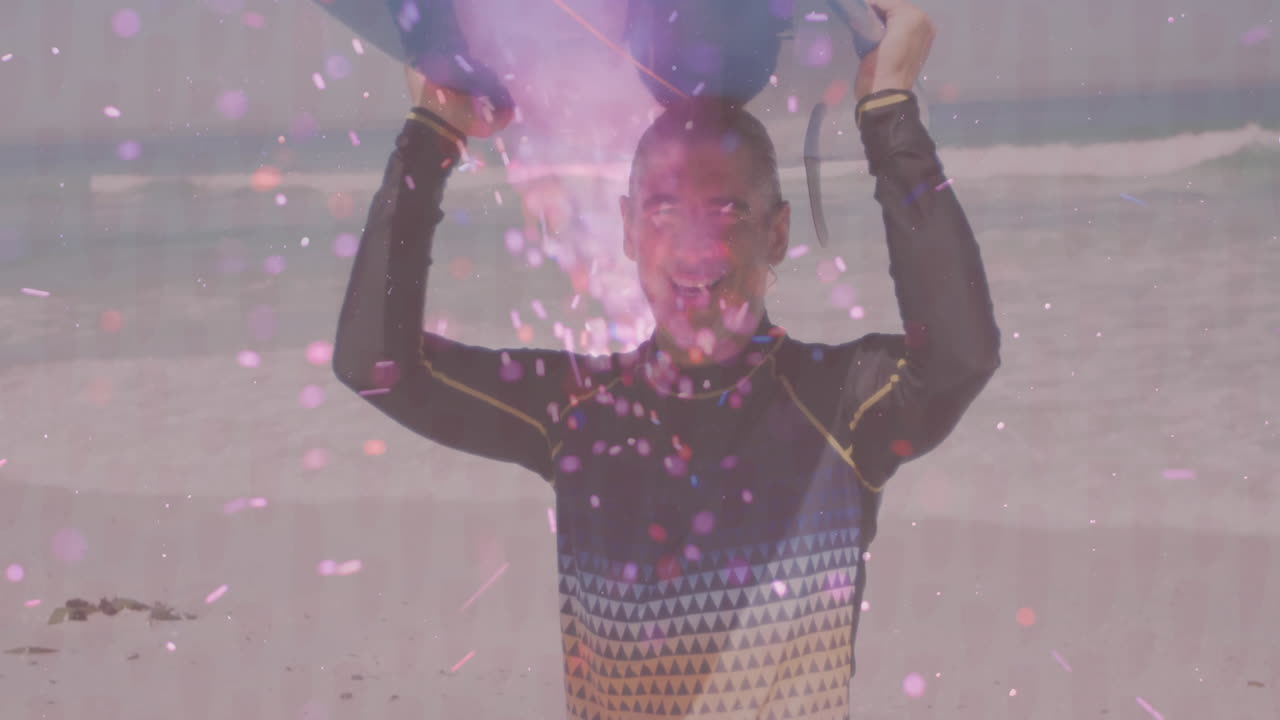 man pouring pink powder on beach, creating floating particle graphics for marketing