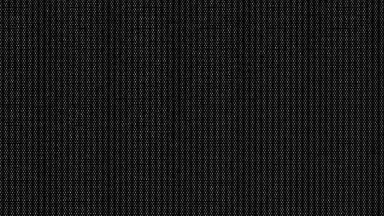 Detailní textura tmavě černé látky