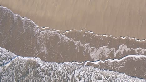 Beautiful-top-view-motion-of-the-sea-waves-in-sunny-day