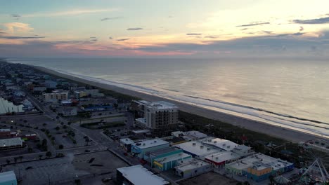 aerial high push over carolina beach nc, north carolina at sunrise