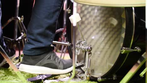 close up of a person playing a bass drum