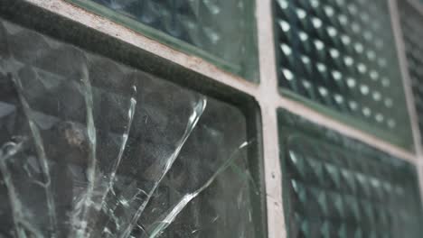 gun shot hole in thick window, vandalising concept