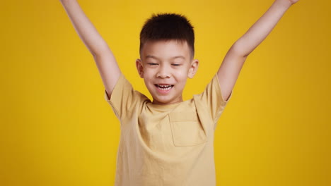 happy child with arms raised