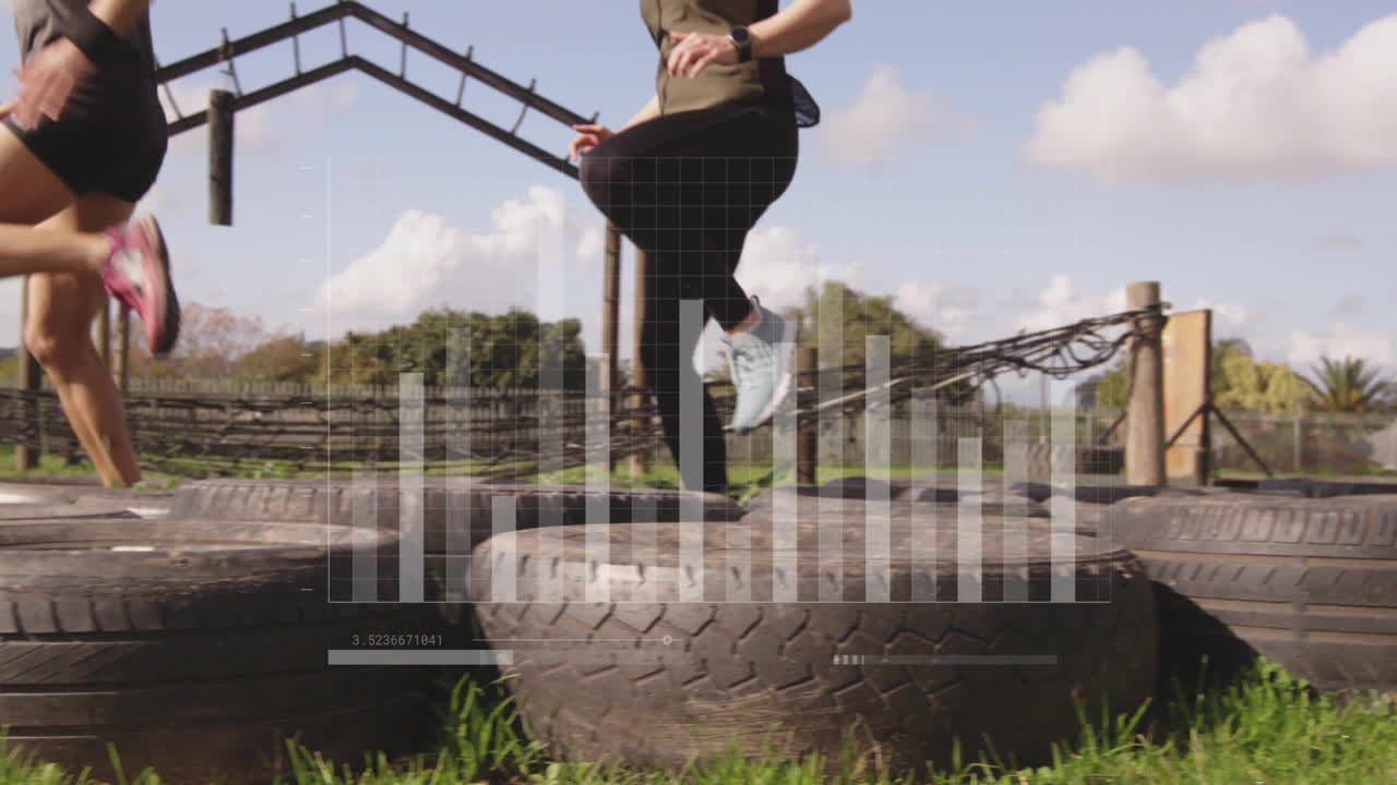People exercising on large tires with data processing animation overlay