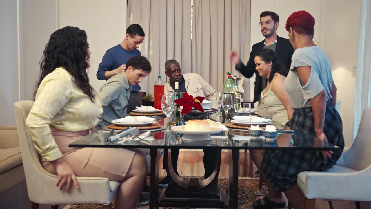 A lively multi-generational gathering transitions from dinner to dancing and celebration