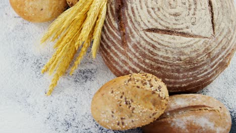 bread loaves with wheat and flour