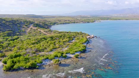 aerial view of playa monte rio, azua, rugged beautiful coastline, coral reef and turquoise blue ocean in dominican republic-closing shot