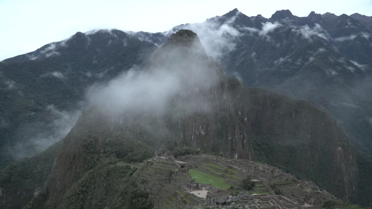 Time Lapse of Machu Picchu with disappearing clouds over the Inca sacred valleyin Peru