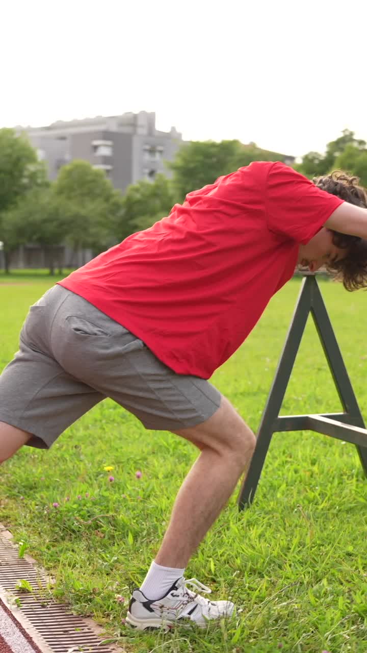 Man stretching outdoors in a park