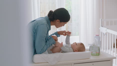 happy-mother-playing-with-baby-at-home-loving-mom-kissing-toddlers-feet-having-fun-parent-bonding-with-child-enjoying-motherhood-childcare