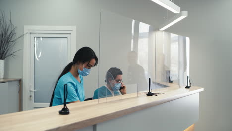 patient consultation with protective measures in a medical office