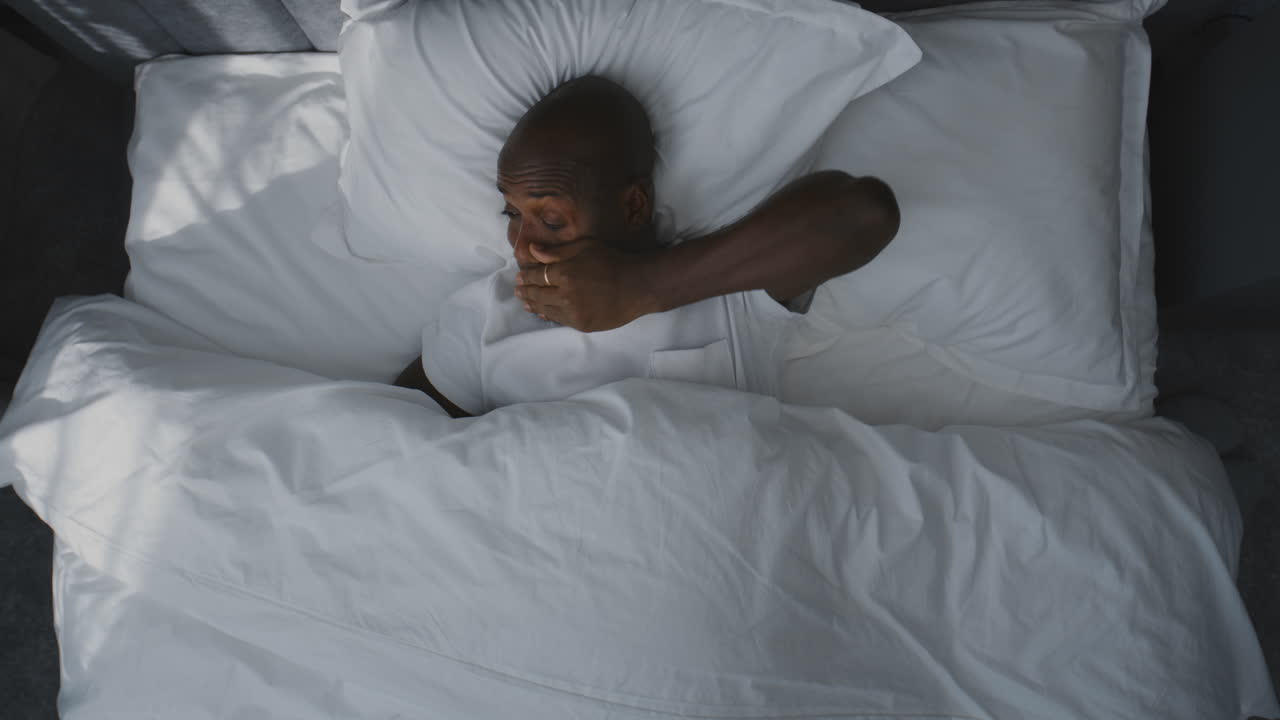 Man Sleeping in Bed
