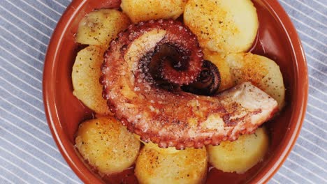 octopus cooking, chef grill fresh octopus galician style on restaurant kitchen, healthy food, seafood cafe in spain, traditional asian japanese spanish and mediterranean dish.