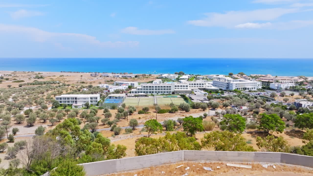 Aerial view over hilltop villa project, toward hotels on sunny Rhodes, Greece